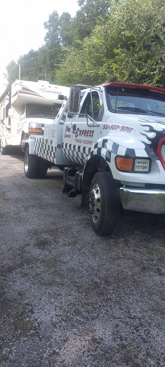 Express Towing and Recovery tow truck with a recreational vehicle